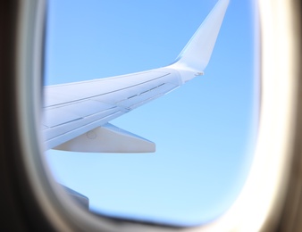 Beautiful view through airplane window during flight. Traveling abroad