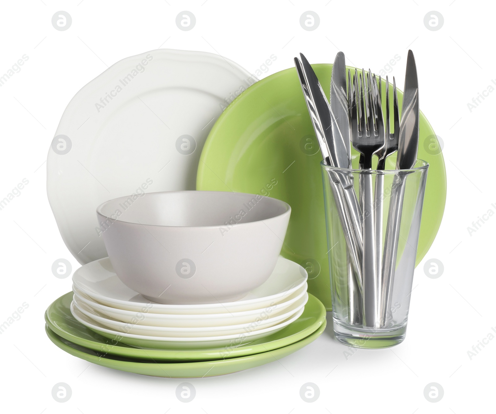 Photo of Set of beautiful ceramic dishware, glass and cutlery isolated on white