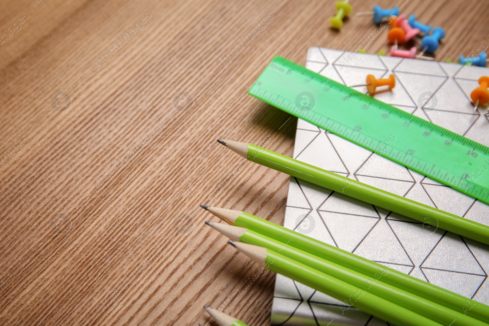 Photo of Different stationery on wooden table. Back to school