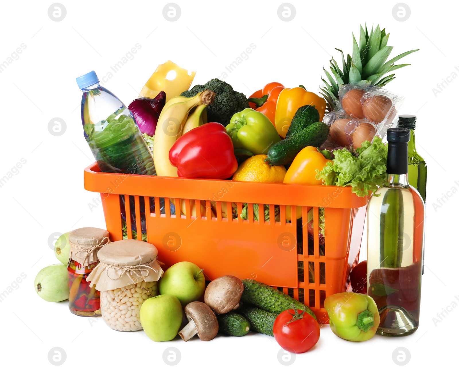 Photo of Shopping basket and grocery products on white background