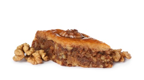 Photo of Delicious honey baklava with walnuts on white background