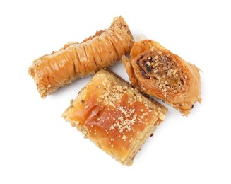 Photo of Eastern sweets. Pieces of tasty baklava isolated on white, top view