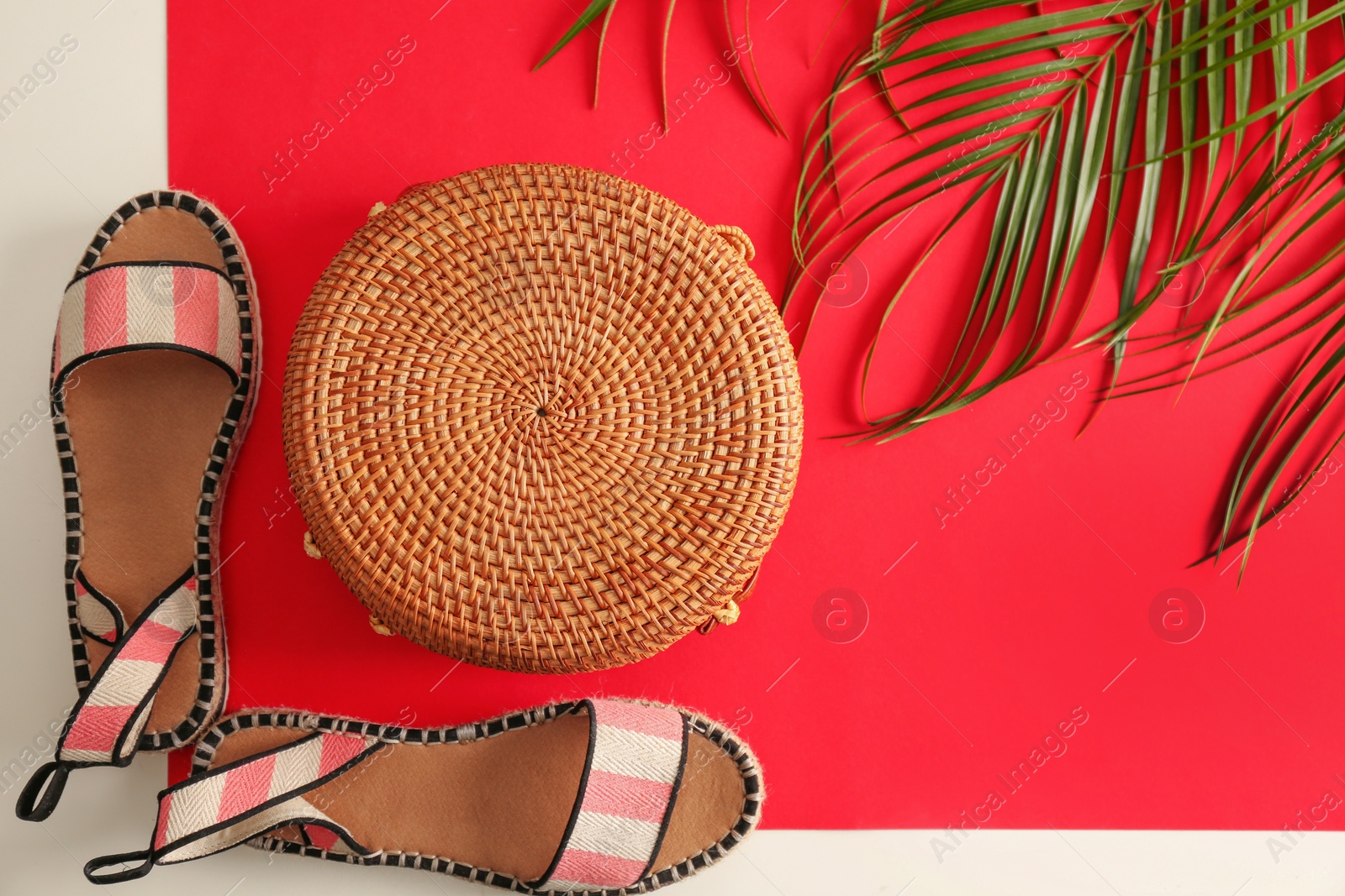 Photo of Flat lay composition with bamboo bag on color background