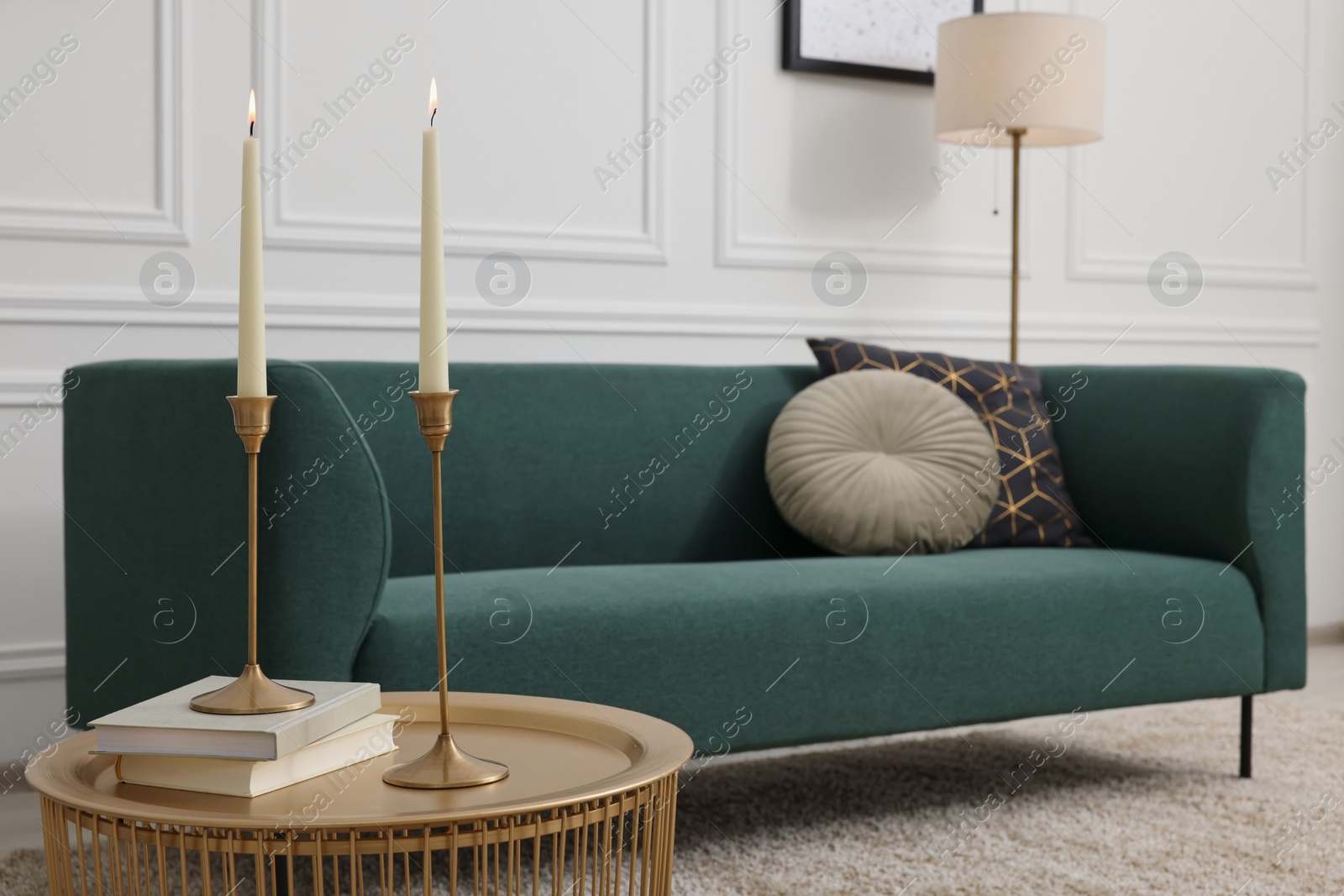 Photo of Stylish living room with soft beige carpet, coffee table and sofa. Interior design