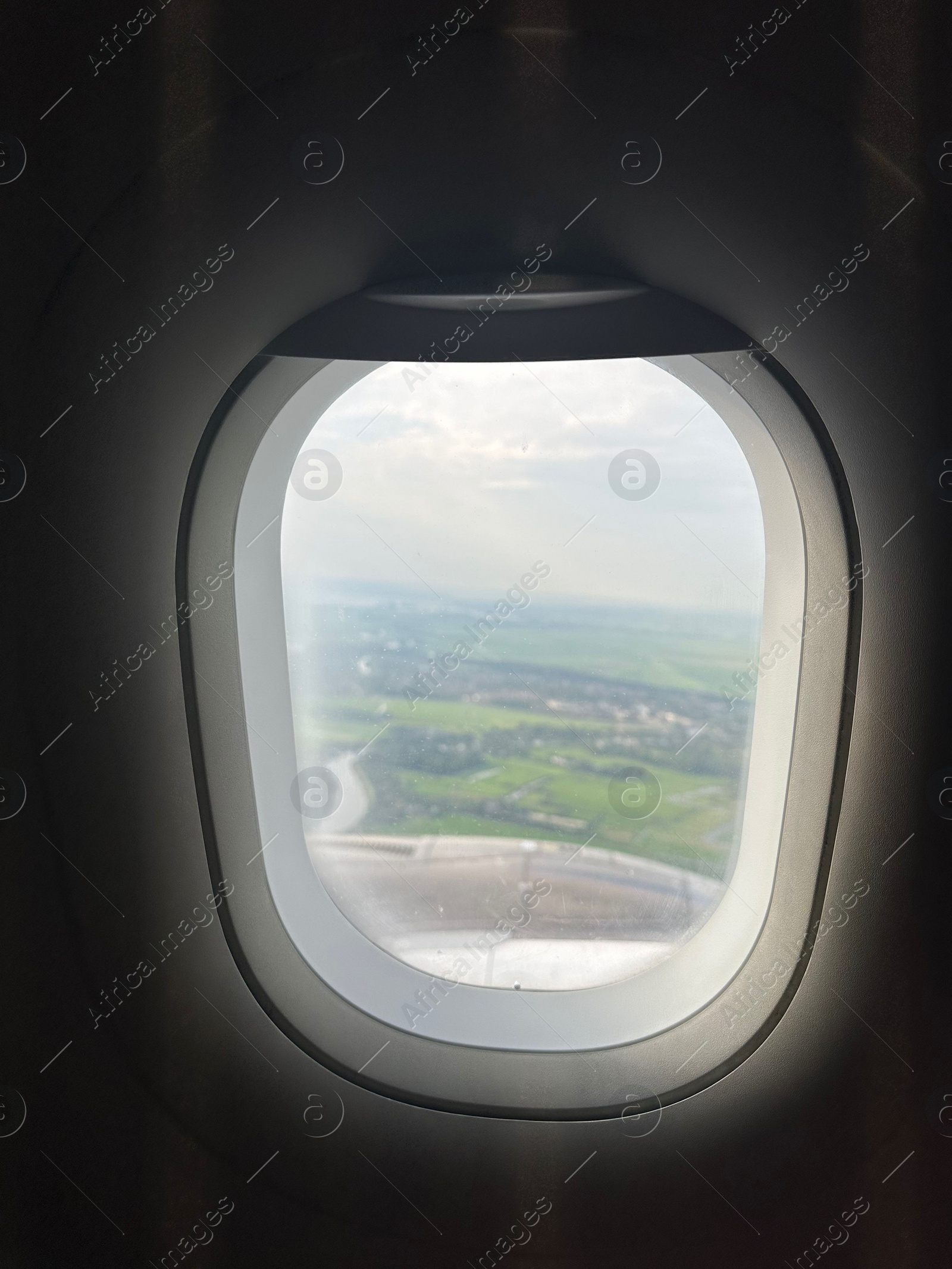 Photo of Picturesque view through plane window during flight