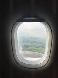 Photo of Picturesque view through plane window during flight