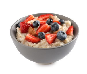 Photo of Tasty oatmeal porridge with blueberries, strawberries and almond nuts in bowl on white background