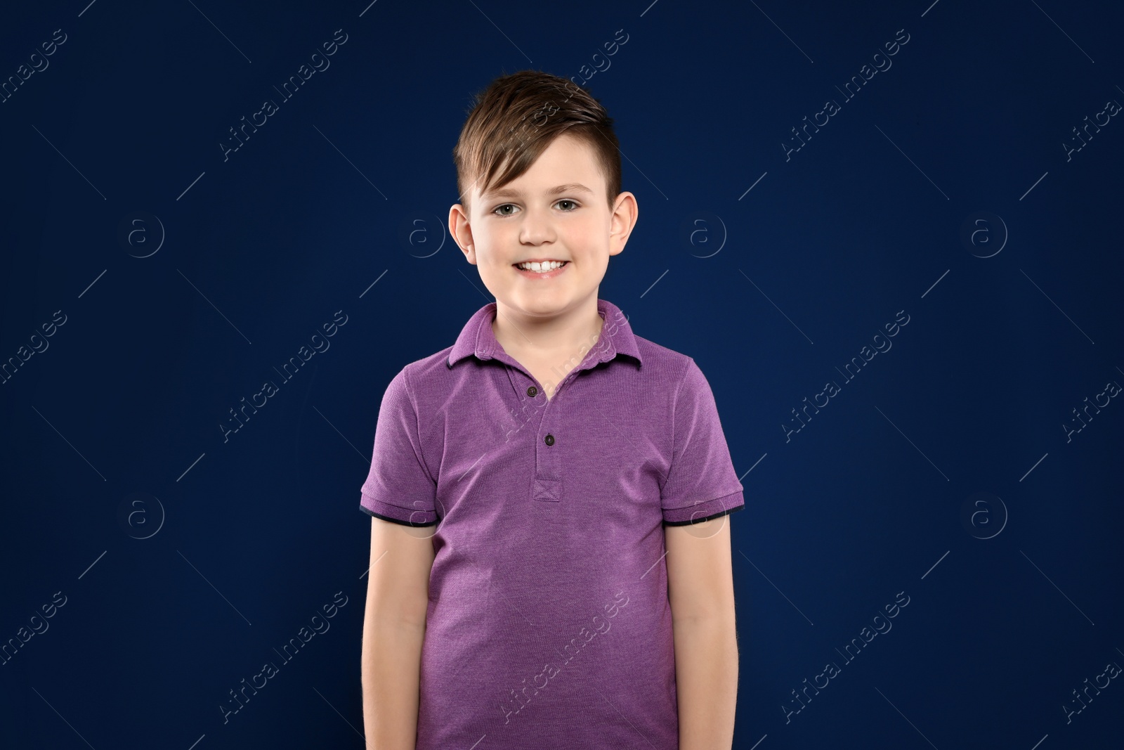 Photo of Portrait of little boy on color background