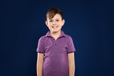 Photo of Portrait of little boy on color background