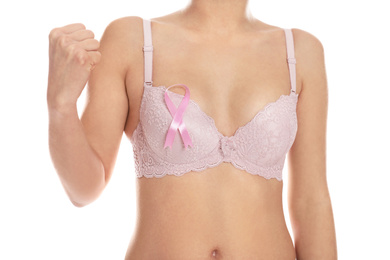 Photo of Woman with pink ribbon on white background, closeup. Breast cancer awareness