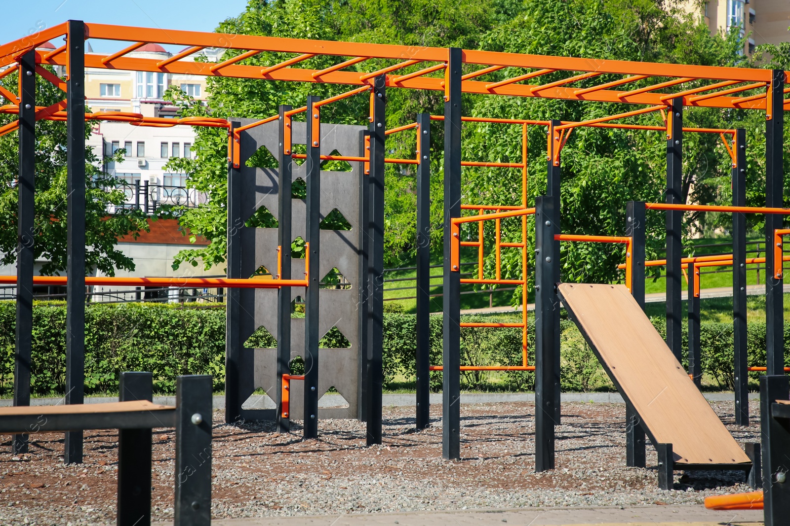 Photo of Empty outdoor gym with exercise equipment in park