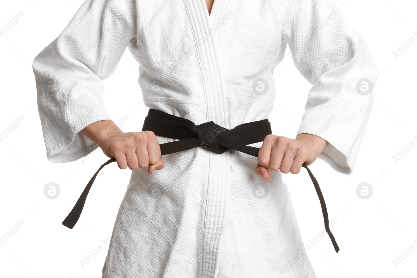 Photo of Martial arts master in keikogi with black belt on white background, closeup