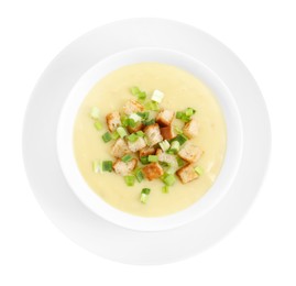 Photo of Tasty potato soup with croutons and green onion in bowl isolated on white, top view