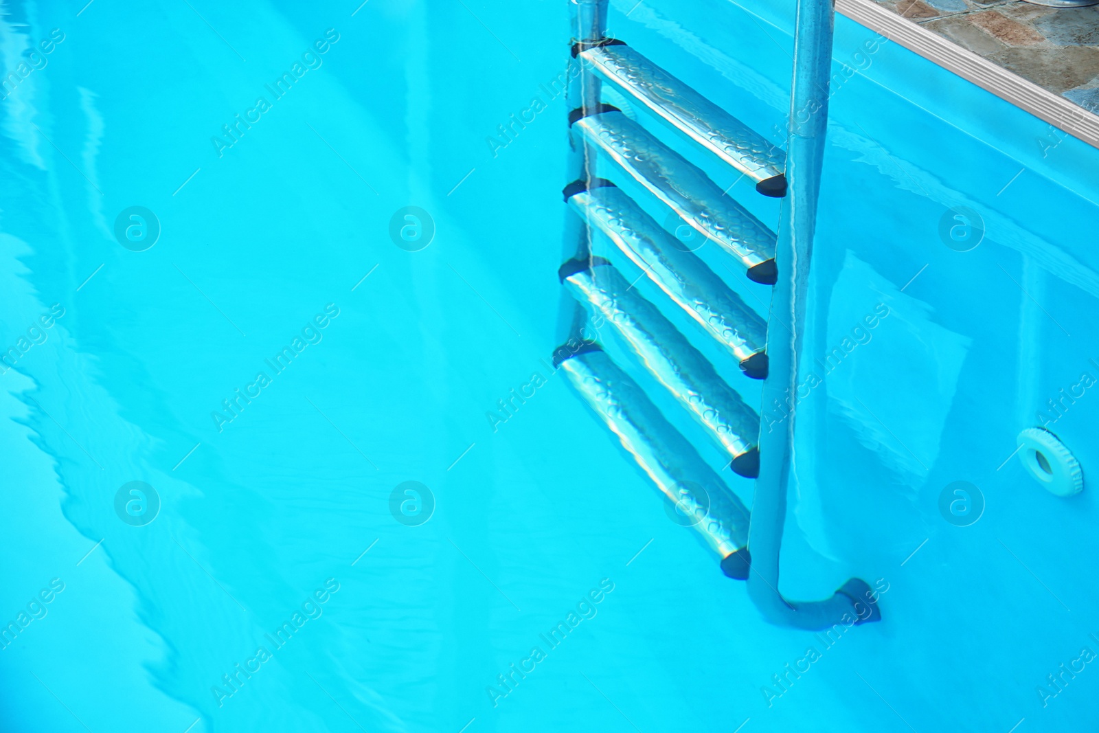 Photo of Modern swimming pool with stairs at resort