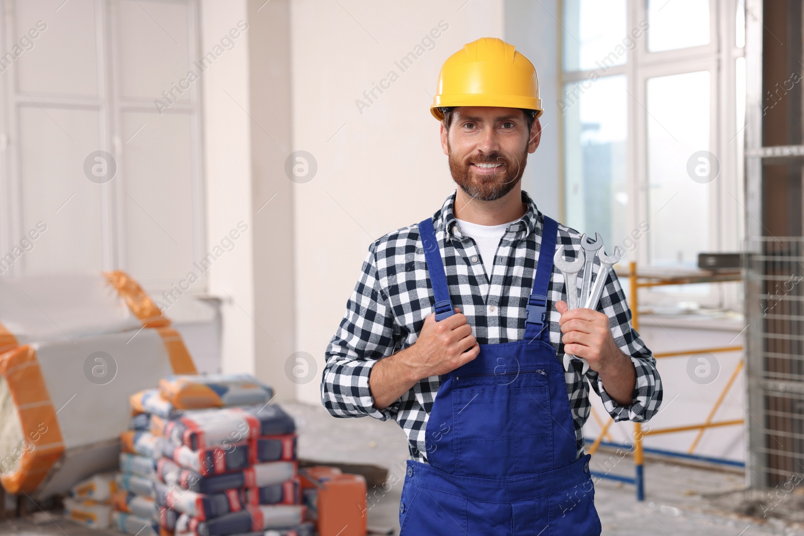 Photo of Portrait of professional builder in uniform indoors