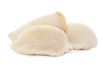 Photo of Raw dumplings with tasty filling on white background