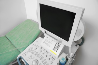 Photo of Ultrasound machine and examination table in hospital, above view