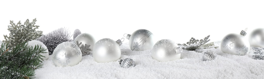 Christmas decoration on snow against white background