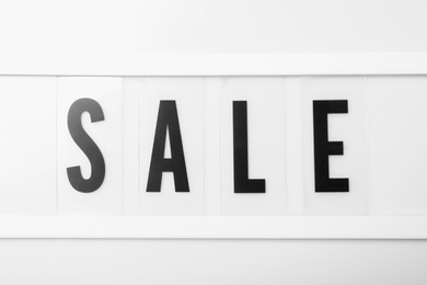 Photo of Lightbox with word Sale as background, closeup. Black Friday