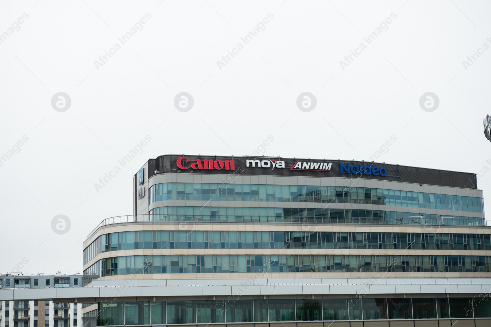 Photo of Warsaw, Poland - September 10, 2022: Building with many modern logos outdoors