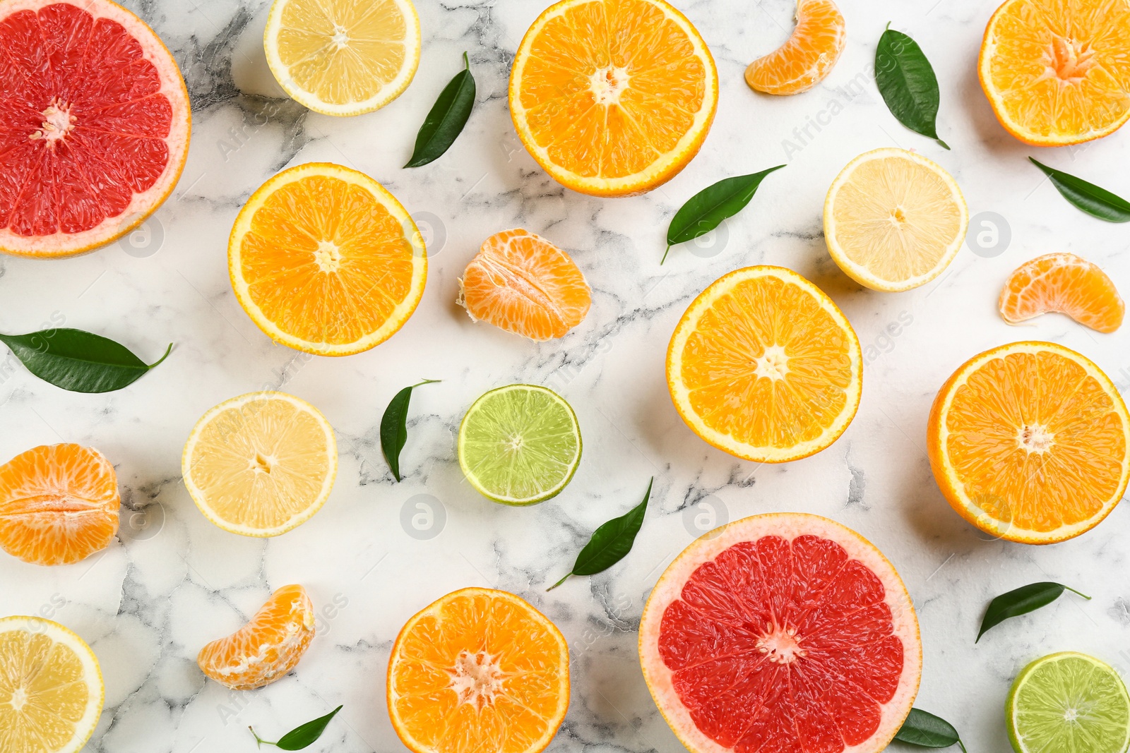 Photo of Flat lay composition with tangerines and different citrus fruits on white marble background