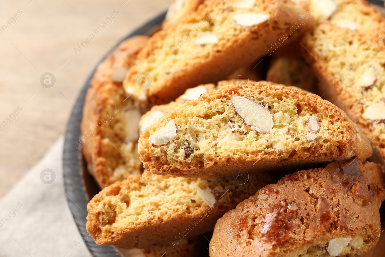 Photo of Traditional Italian almond biscuits (Cantucci) in bowl, closeup