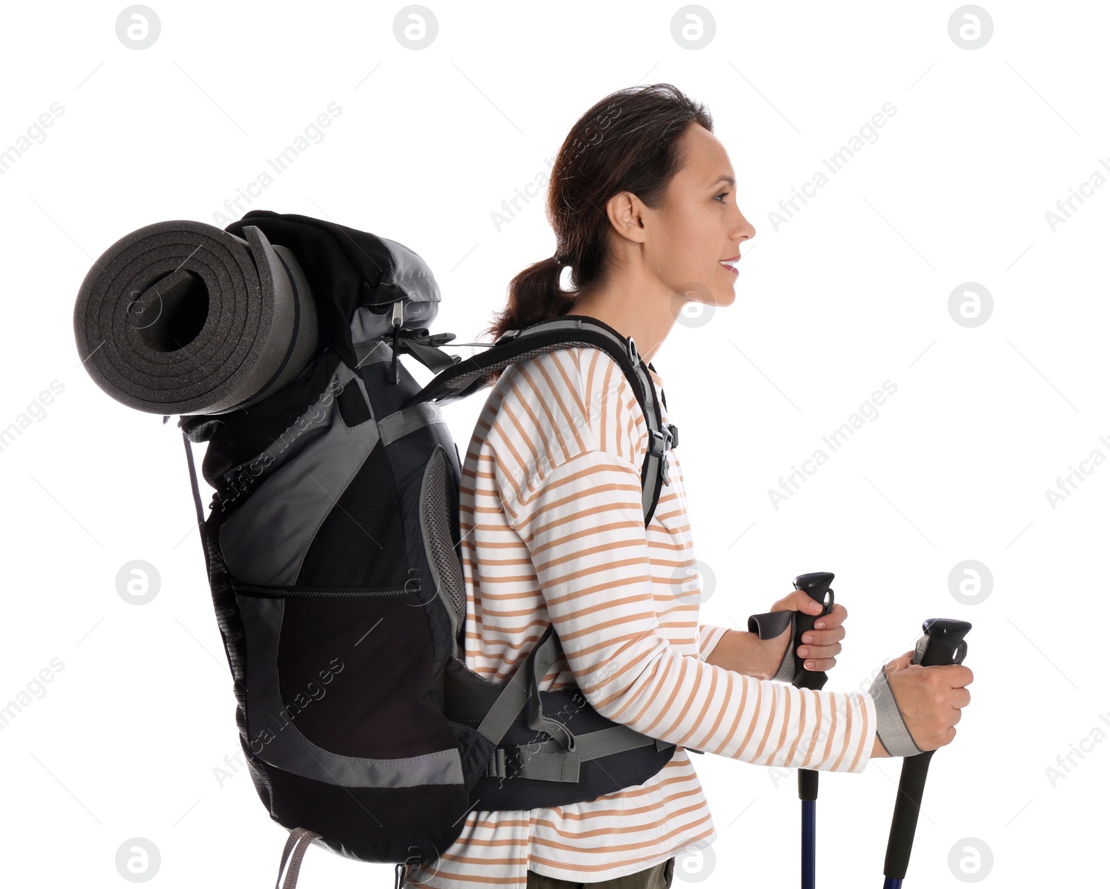 Photo of Female hiker with backpack and trekking poles on white background