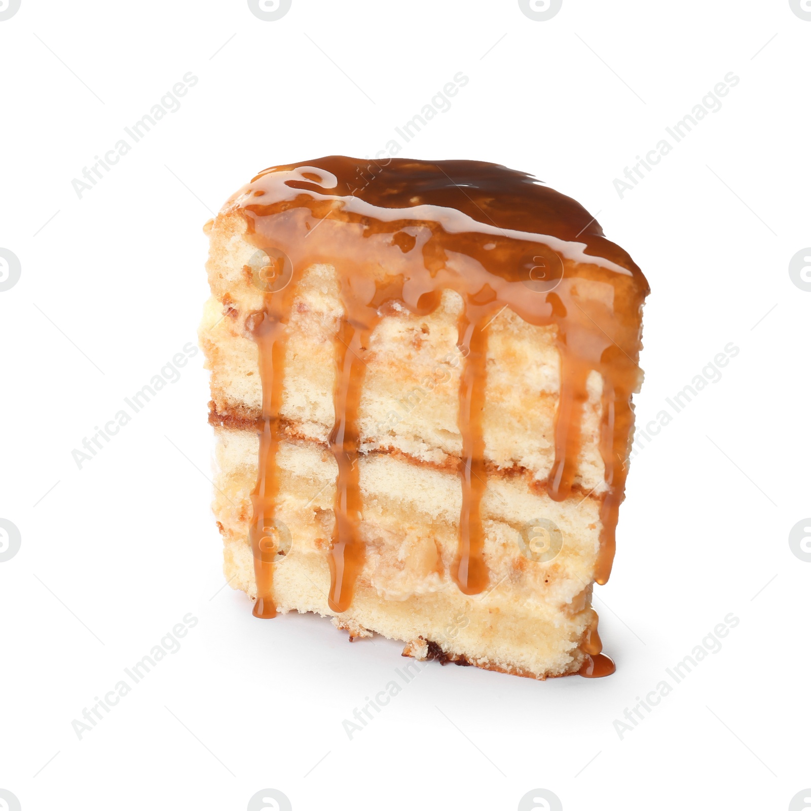 Photo of Piece of delicious homemade cake with caramel sauce white background