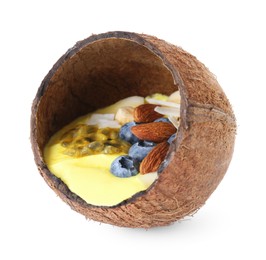 Photo of Tasty smoothie bowl with fresh blueberries and almonds in coconut shell isolated on white