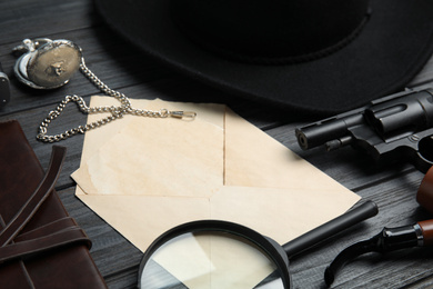 Photo of Composition with different vintage items on grey wooden table, closeup. Detective's workplace