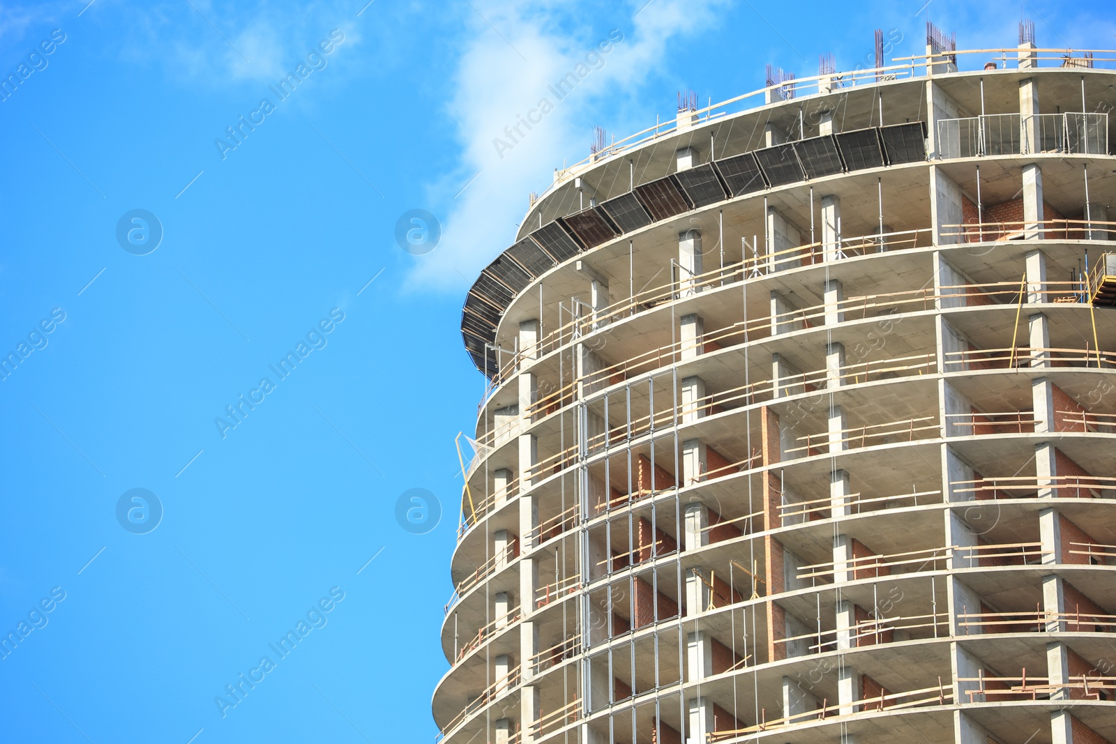 Photo of Unfinished building against blue sky, space for text. Construction safety rules