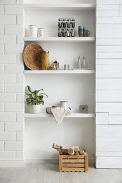 Photo of Many shelves with different decor in room. Interior design