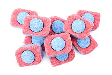 Pile of dishwasher detergent tablets on white background, top view