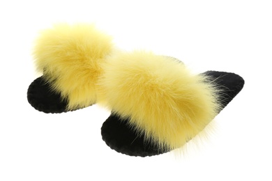 Photo of Pair of soft open toe slippers with yellow fur on white background