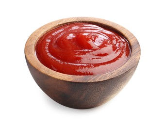 Photo of Tasty ketchup in wooden bowl isolated on white. Tomato sauce