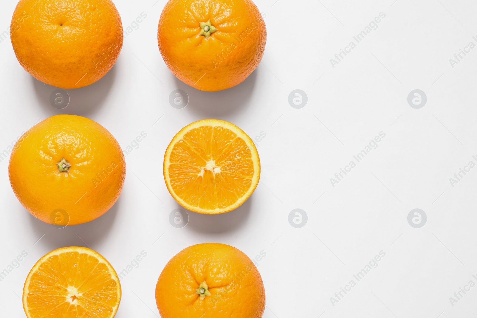 Photo of Composition with ripe oranges on white background, top view