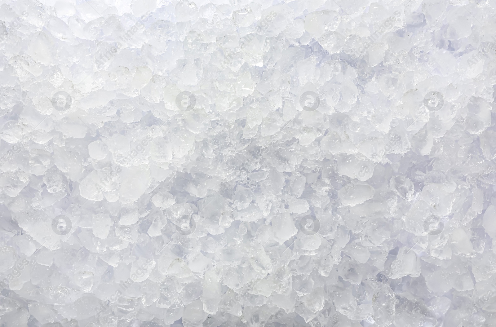 Photo of Clear crushed ice as background, top view