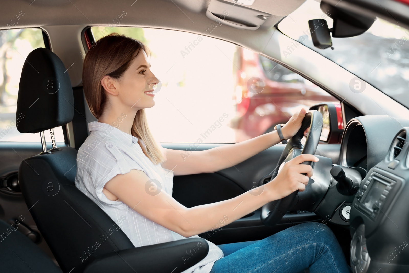 Photo of Happy beautiful woman driving modern car