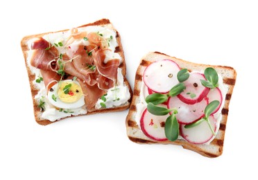 Delicious sandwiches with microgreens on white background, top view