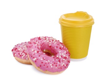 Photo of Two delicious donuts with sprinkles and hot drink isolated on white