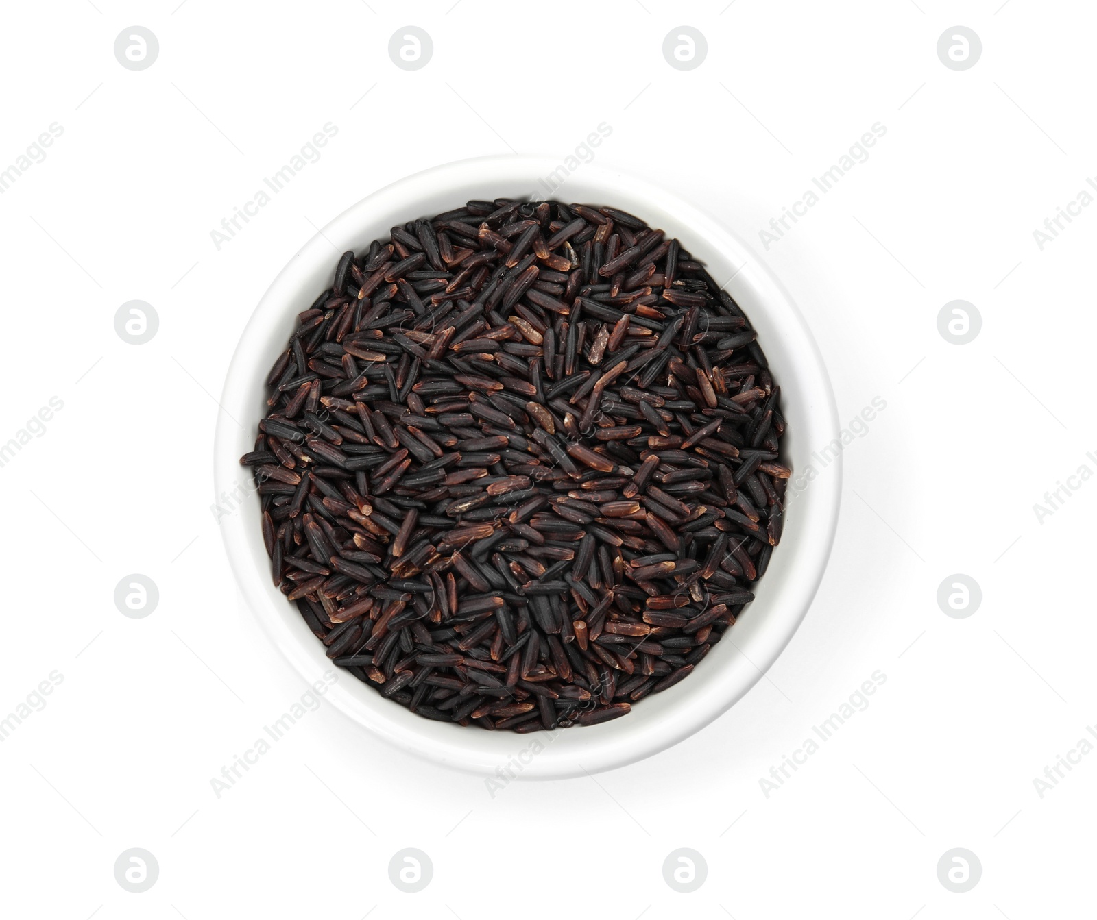 Photo of Bowl with uncooked black rice on white background, top view