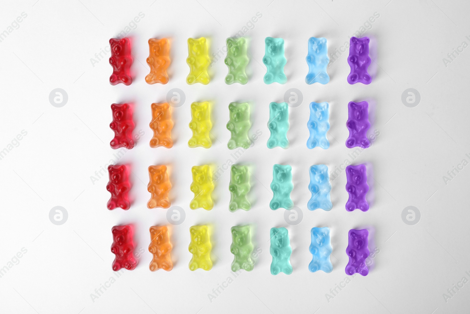 Photo of Delicious jelly bears on white background, top view