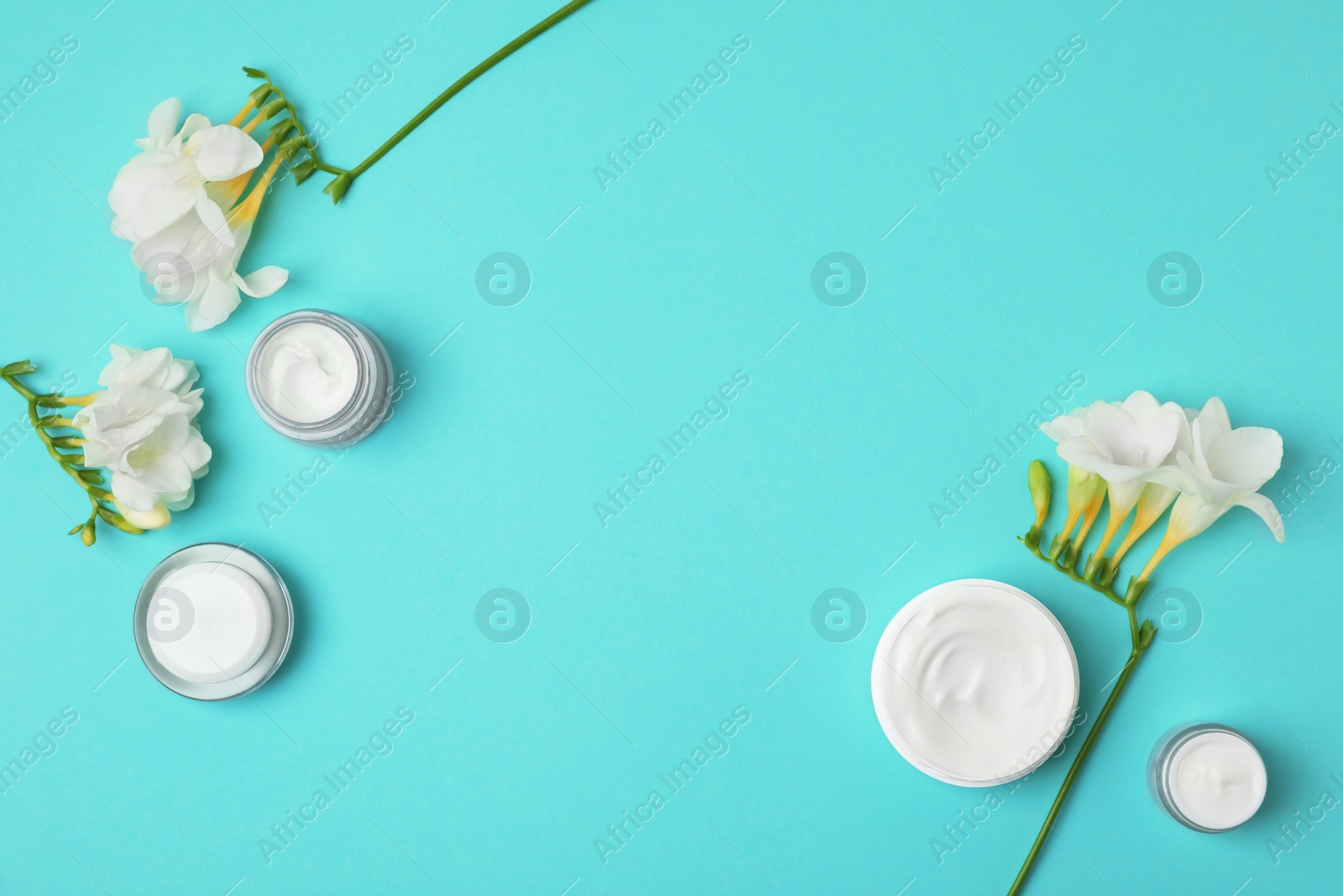 Photo of Flat lay composition with cosmetic products on color background