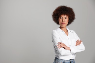 Photo of Portrait of beautiful young woman on grey background. Space for text