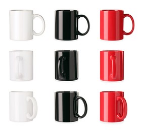 Image of Set with different ceramic mugs on white background