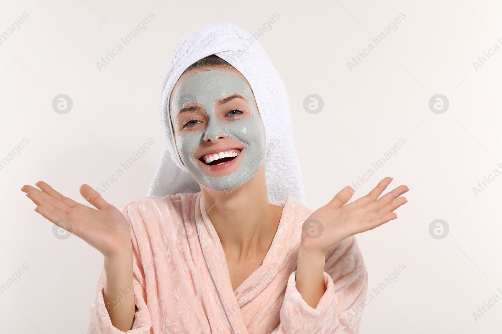 Photo of Woman with face mask on white background, space for text. Spa treatments