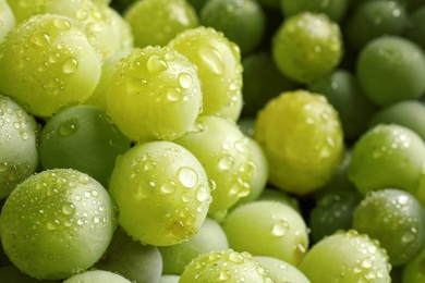 Bunch of green fresh ripe juicy grapes as background. Closeup view