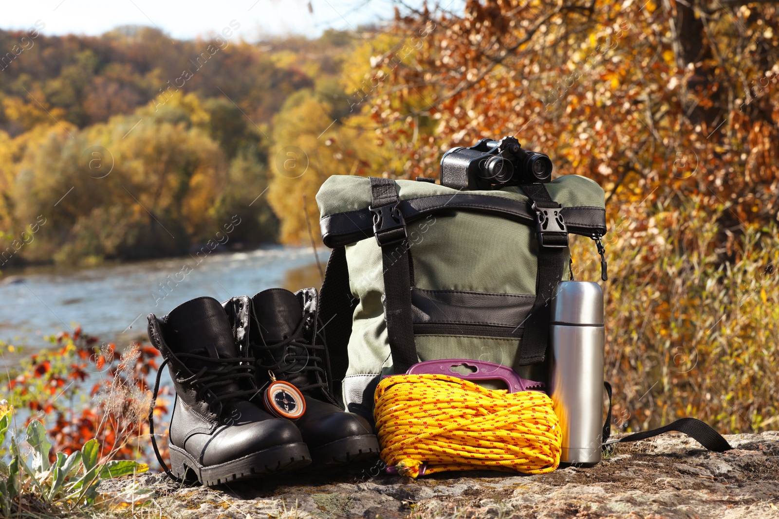 Photo of Set of camping equipment on ground outdoors