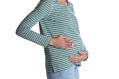 Photo of Young pregnant woman smoking cigarette on white background, closeup. Harm to unborn baby