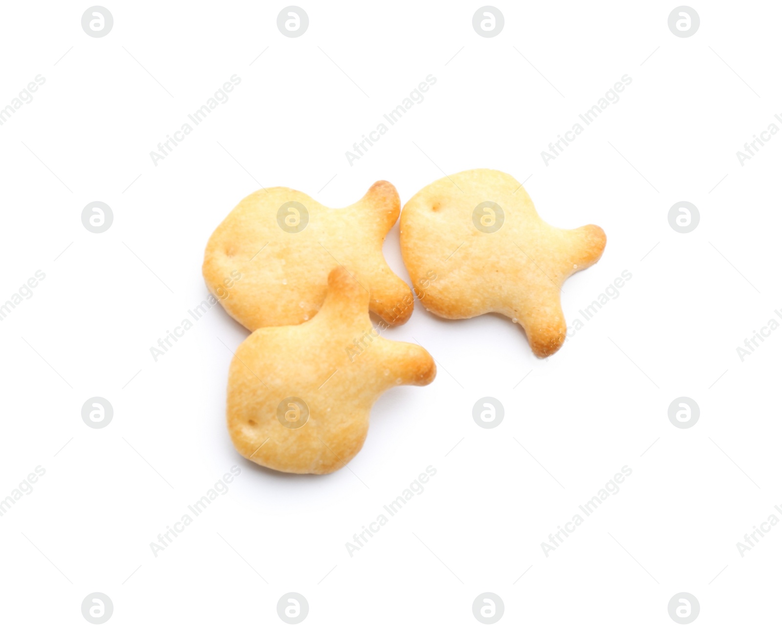 Photo of Delicious crispy goldfish crackers on white background, top view